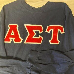 Navy blue long sleeve with red and white patched lettering